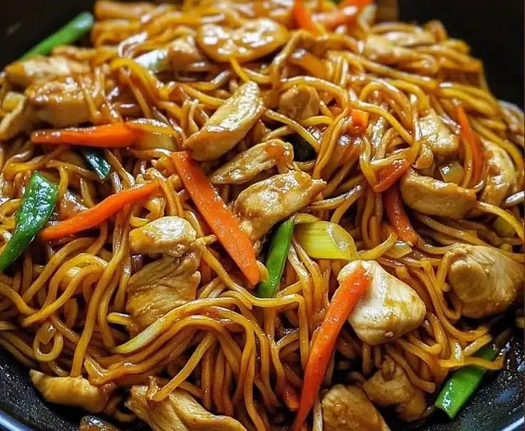 Homemade Chicken Lo Mein with vegetables and noodles in a bowl