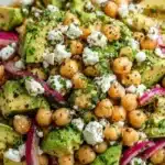 Colorful Chickpea Feta Avocado Salad with fresh ingredients in a bowl