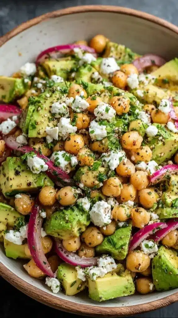 Colorful Chickpea Feta Avocado Salad with fresh ingredients in a bowl