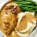 Plate of creamy garlic chicken with herbs and spices