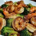 High-protein honey garlic shrimp dish served on a plate with garnishes