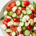 Juicy Cucumber Caprese Salad with cucumbers, mozzarella, and fresh basil