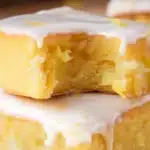 Delicious lemon brownies cut into squares on a plate