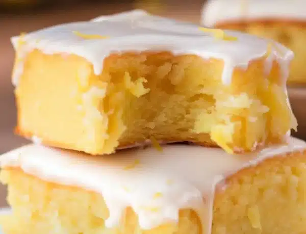 Delicious lemon brownies cut into squares on a plate