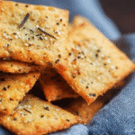 A plate of low carb crackers ideal for healthy snacking on a keto diet.