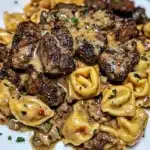 One-pan cowboy butter tortellini with steak bites on a plate