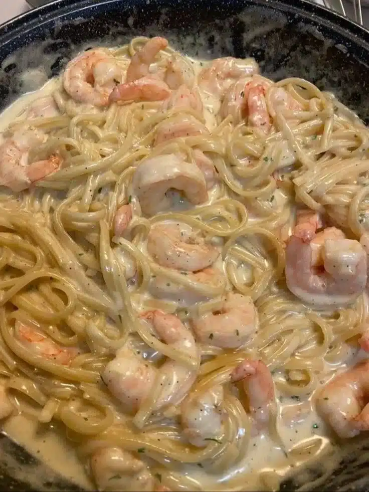Delicious One Pan Shrimp Fettuccine Alfredo prepared and served in a skillet.