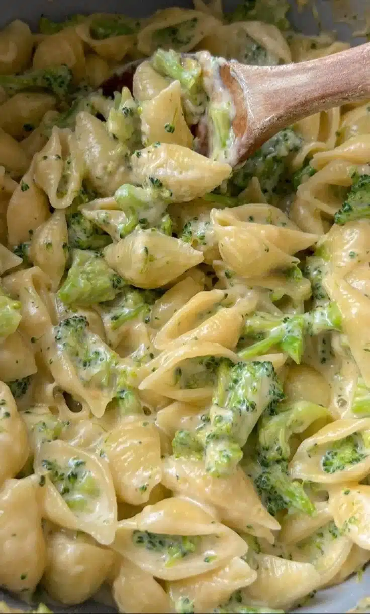 One pot healthy broccoli mac and cheese in a bowl with broccoli florets
