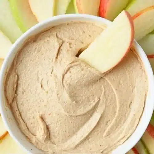 Creamy peanut butter yogurt dip served with fresh apple slices