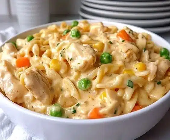 Delicious Chicken Pot Pie Pasta served in a bowl with fresh herbs