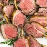 Succulent rack of lamb served with a side of roasted vegetables