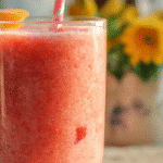 Bright Breakfast Smoothie with fruits and greens in a glass