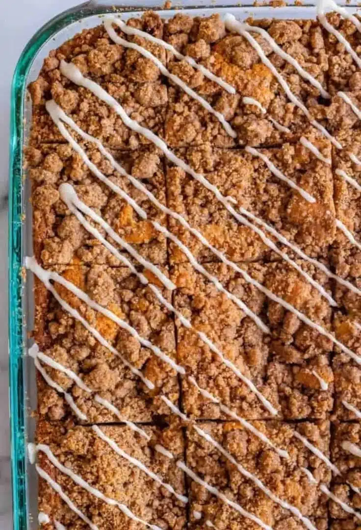 Sour Cream Streusel Coffee Cake with a crumbly topping on a plate.