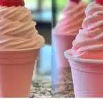 Strawberry Dole Whip served in a bowl with fresh strawberries