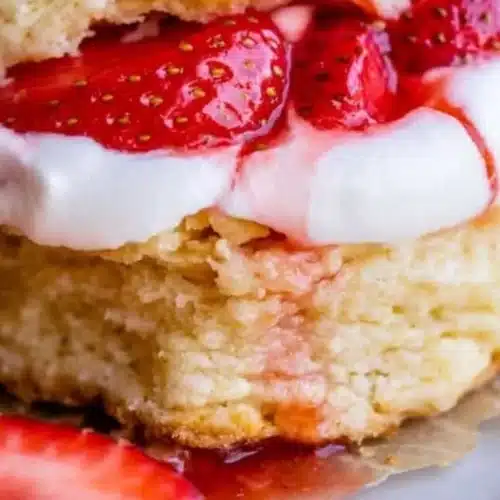 Homemade strawberry shortcake topped with fresh strawberries and whipped cream