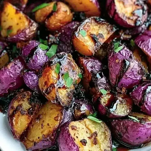 Serving of Balsamic Purple Potatoes garnished with herbs