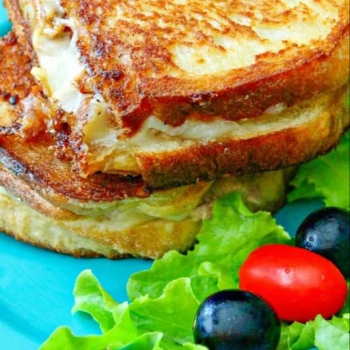 Delicious homemade tuna melt sandwich with melted cheese and tuna filling