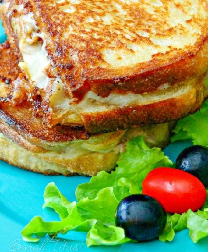 Delicious homemade tuna melt sandwich with melted cheese and tuna filling