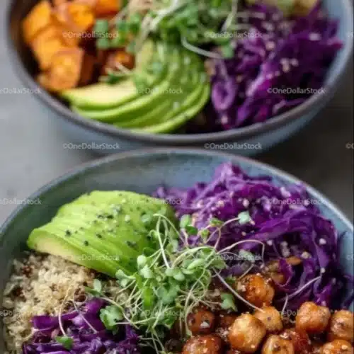 A vibrant vegan bowl filled with colorful vegetables, grains, and fresh herbs.