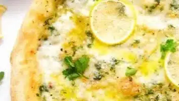 Delicious homemade lemon pizza topped with fresh ingredients