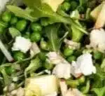 Fresh and vibrant pea salad with vegetables and dressing