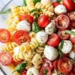 Colorful Caprese Pasta Salad with fresh tomatoes, mozzarella, and basil