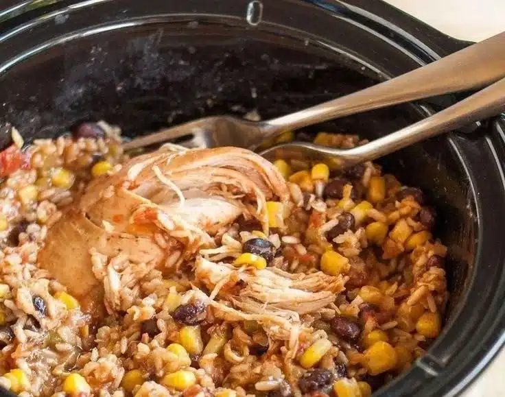 Delicious slow-cooker chicken burrito bowls with colorful toppings