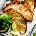 Crispy black bean tacos served with fresh toppings and sides