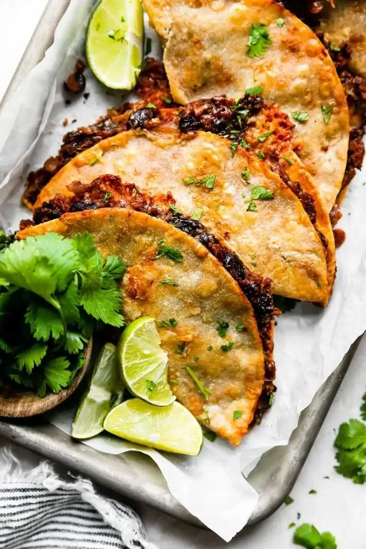 Crispy black bean tacos served with fresh toppings and sides