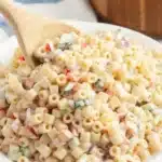 Bowl of colorful Ditalini Pasta Salad with fresh vegetables and dressing
