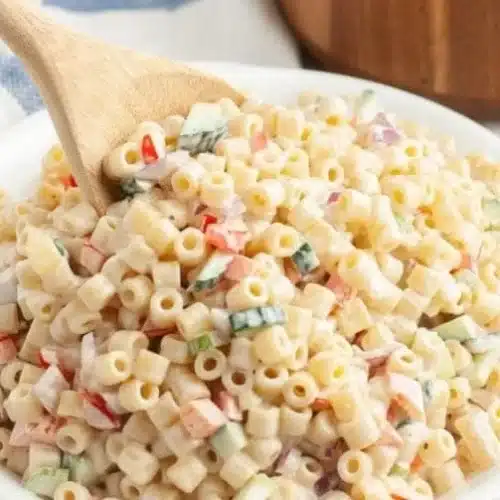 Bowl of colorful Ditalini Pasta Salad with fresh vegetables and dressing