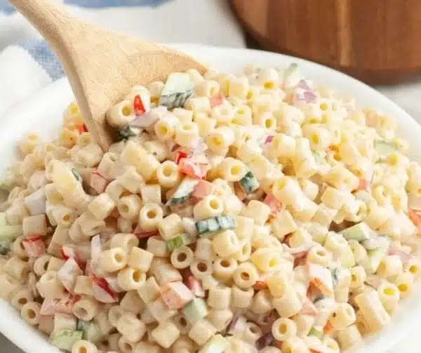 Bowl of colorful Ditalini Pasta Salad with fresh vegetables and dressing