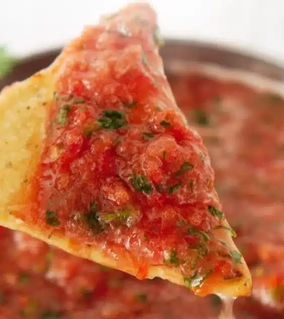 Bowl of easy homemade salsa with fresh ingredients and vibrant colors