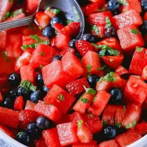 Honey Lime Mint Watermelon Berry Fruit Salad with colorful fresh fruits
