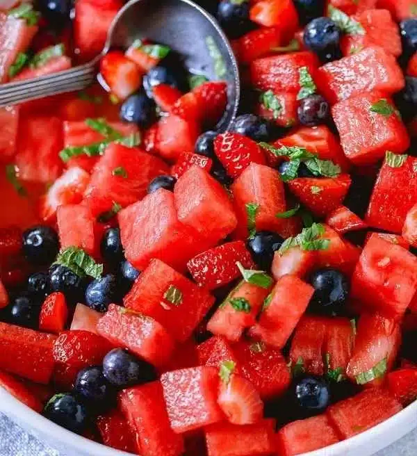 Honey Lime Mint Watermelon Berry Fruit Salad with colorful fresh fruits