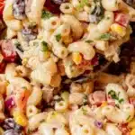 Bowl of vibrant Mexican macaroni salad with colorful veggies and seasoning