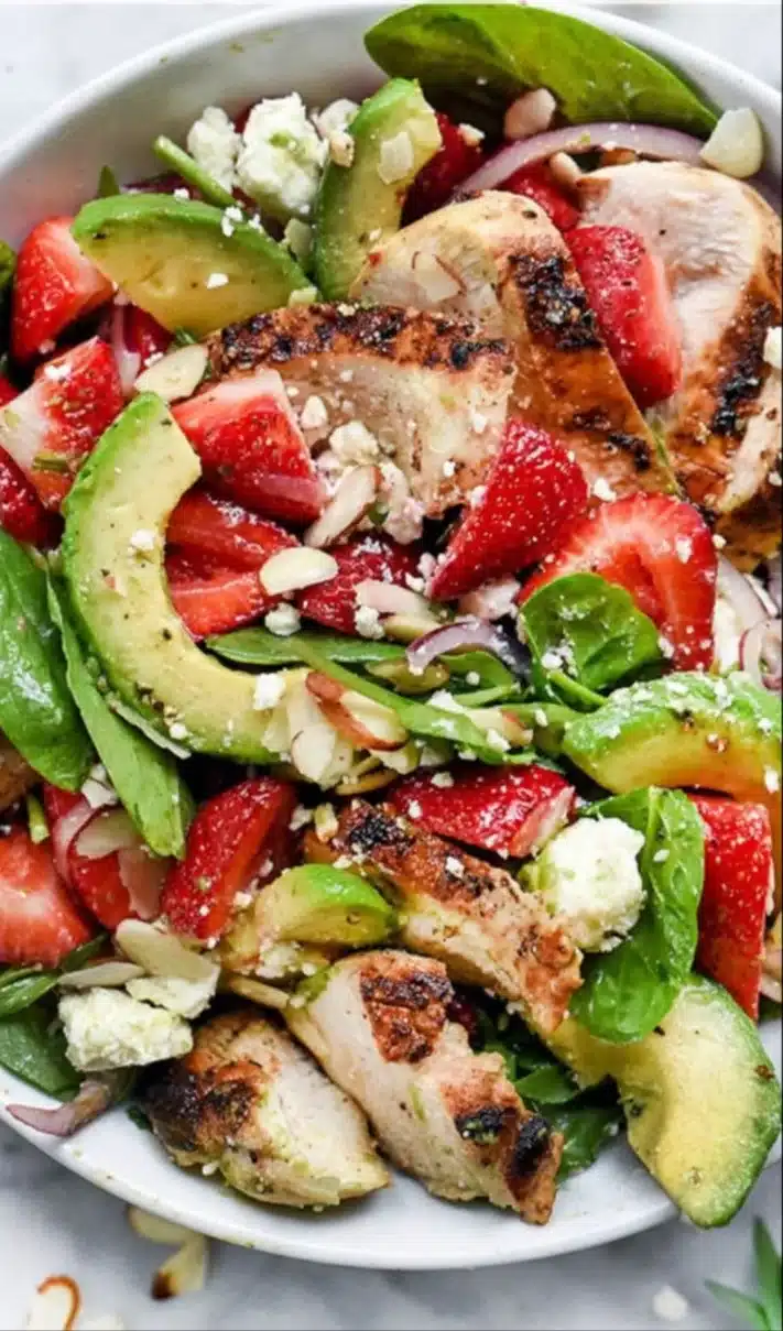 Strawberry Avocado Spinach Salad with Chicken in a bowl