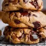 A plate of giant chocolate chip cookies fresh out of the oven